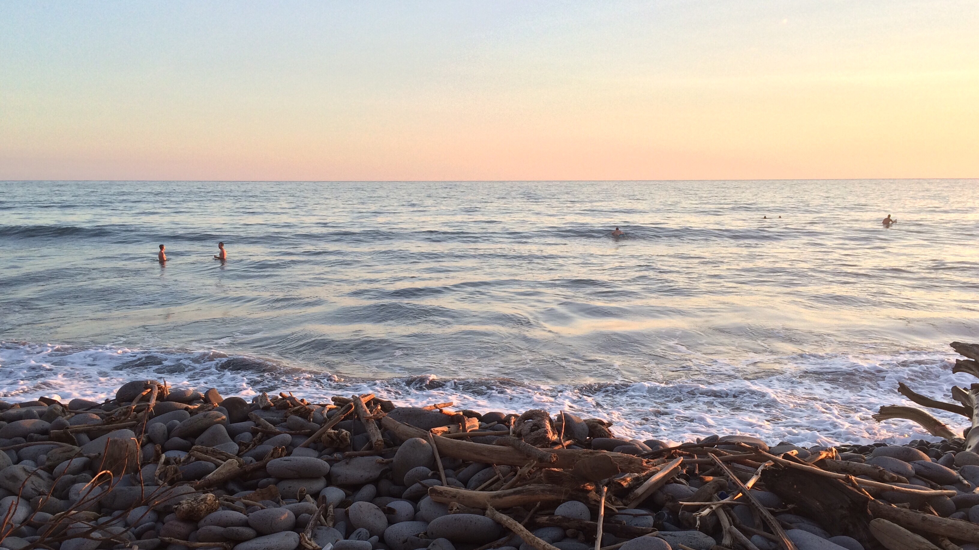 Sky! Water! Rocks! Driftwood! Folks swimming!